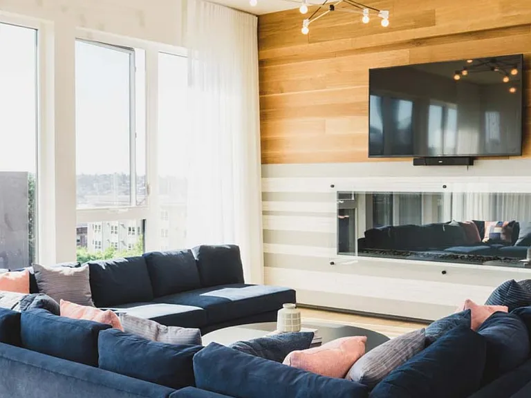 North Building Lobby features glass-walled fireplace and HDTV, perfect for cozy gatherings