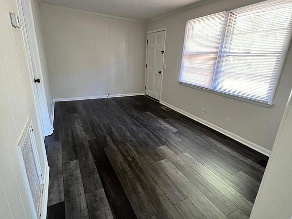 Side view of living room, new flooring, and colors.