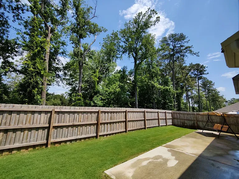Fenced backyard with large patio for summer barbeque and more!