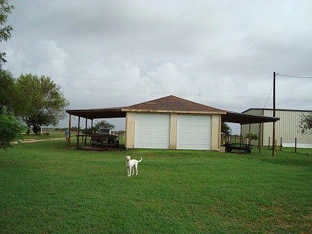 The Detached Garage and Carports are well away from the Home