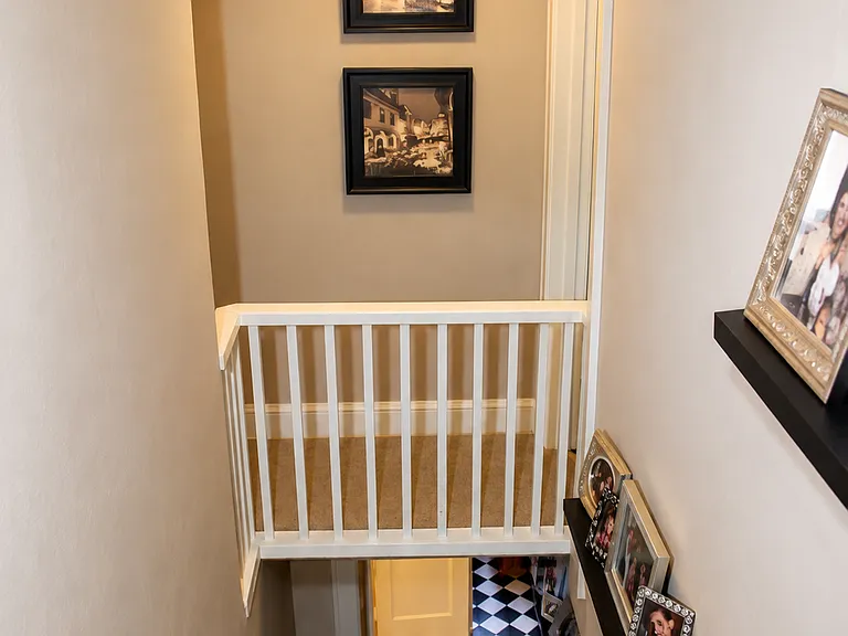 view from top of staircase on upper level