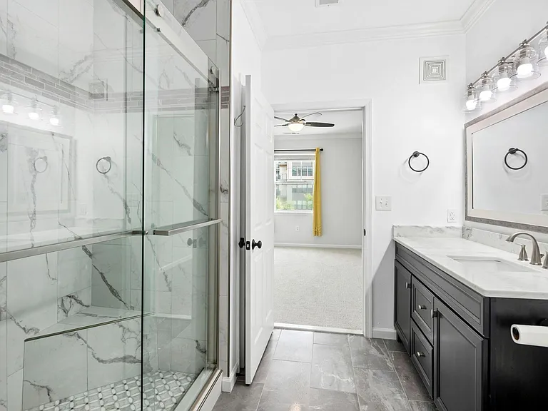 Main bathroom and main bedroom view.