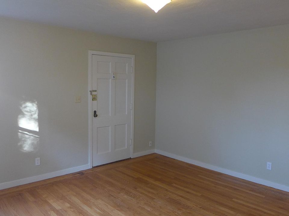 Unfurnished view of living room toward front door.