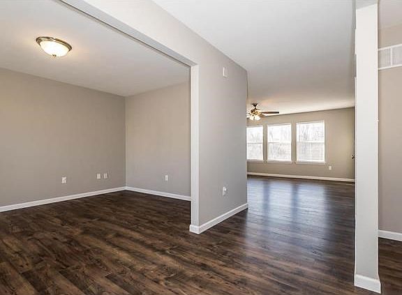 View of Main Floor Office and into the Living Room. Newer flooring through out main level.