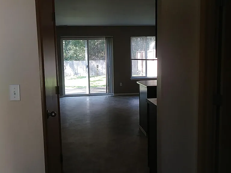 Hallway into main living area, slider to backyard, lots of natural light!