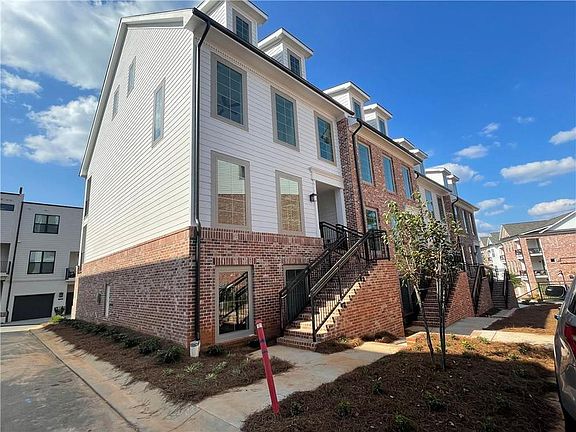 Beautiful brick and HardiPlank building that has both the Crawford and Hathaway plans.