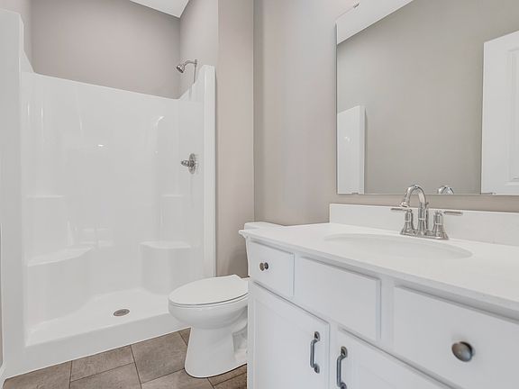 Step In Shower With A Hard Surface Vanity.