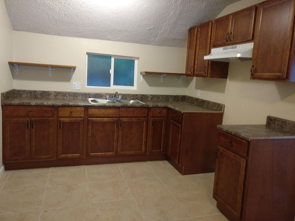brand new kitchen-new sink, vent, counter top and faucet