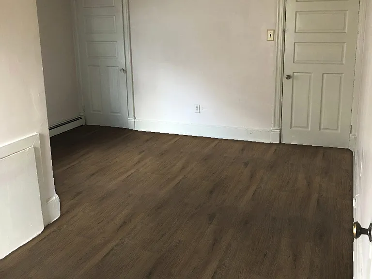 Bedroom with two windows, two large closets, and bathroom