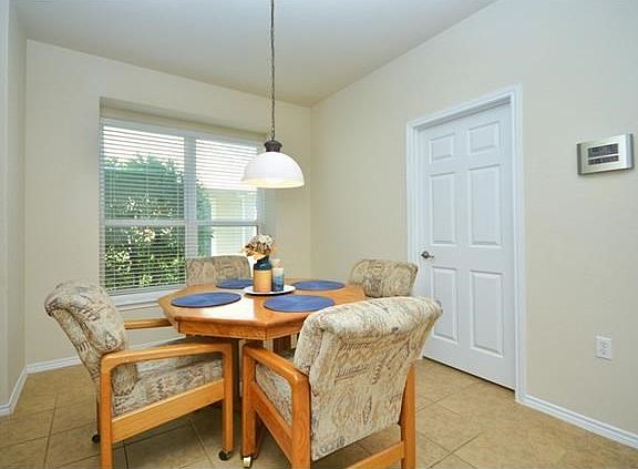 ...the cheerful breakfast room complete with window seat.