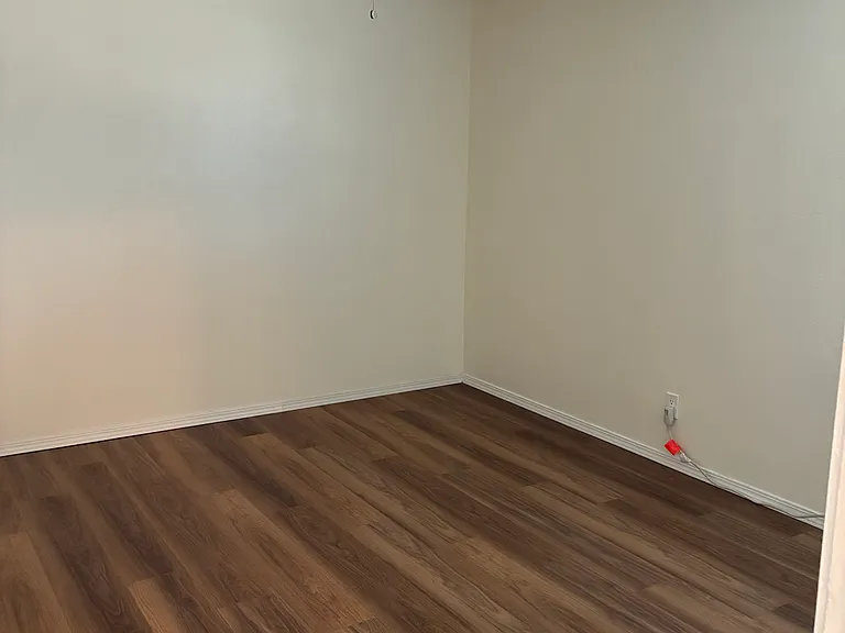 Bedroom with laminate flooring