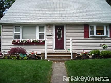 Beautifully Landscaped front yard
						:
						New windows and vinyl siding