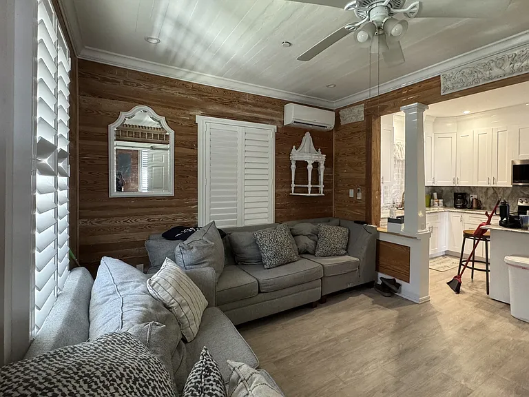 Expansive ceilings and beautiful dade county pine walls with architecture design throughout.
