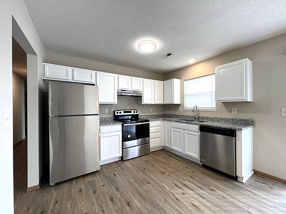 Some units have white cabinets and stainless steel appliances