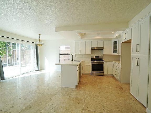 Kitchen opens space to family room, and dining area