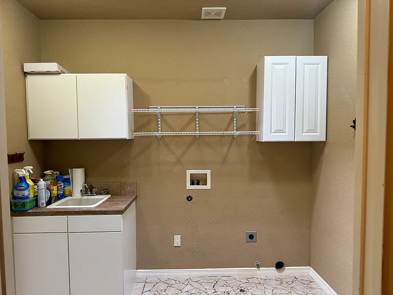 Laundry room with utility sink