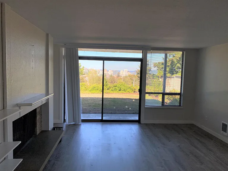 Sliding glass door leading to patio, additional storage and backyard