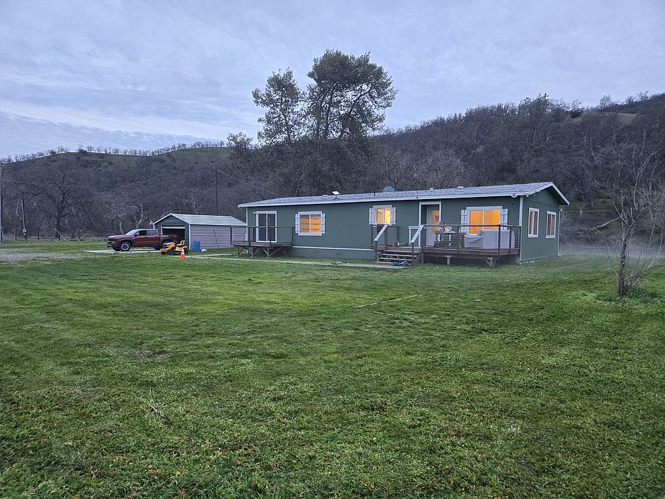 Frount of house and 2 car detached garage