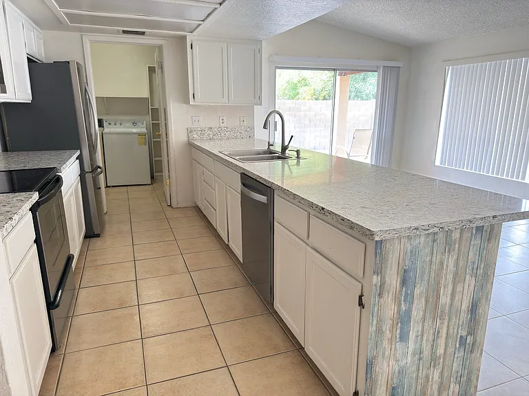 Kitchen view Does not show new paint or new ceilign lights.