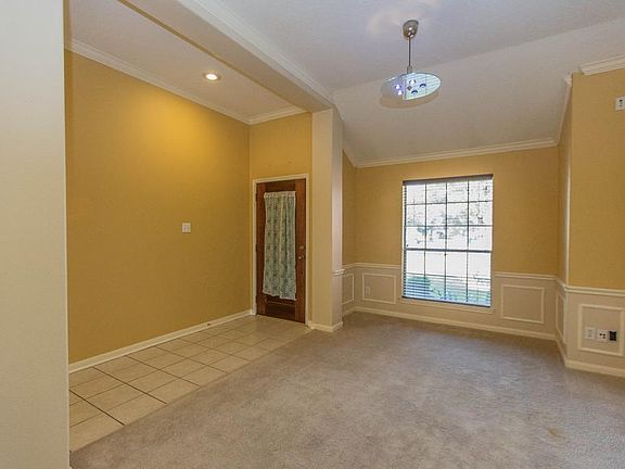 This formal living/dining room could easily be framed in to create a study or home office!
