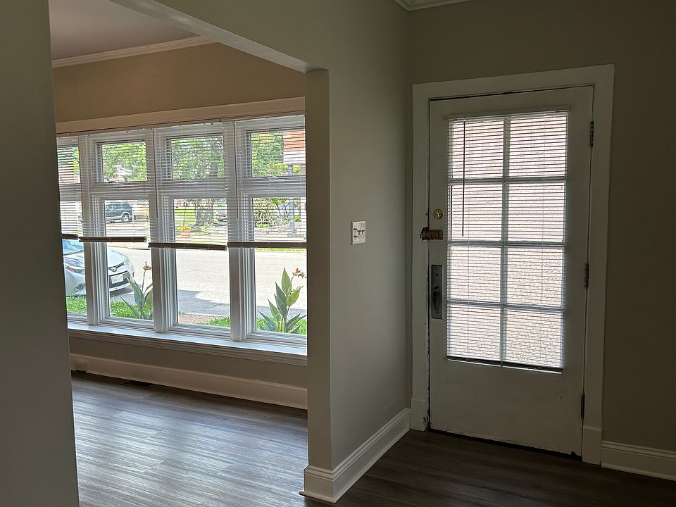 Front door and living room with large front window