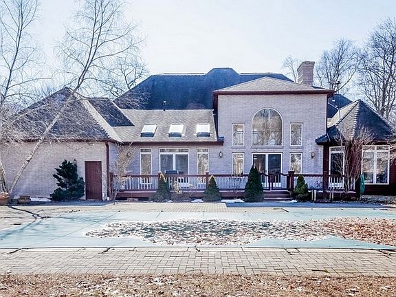 Back of house with deck and pool