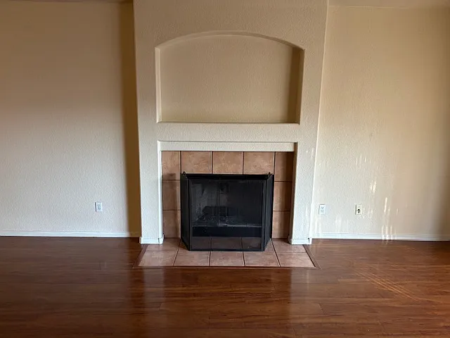 Wood fireplace in family room.