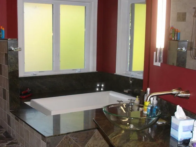 Next to open shower, Kohler soaking tub with built in heater and jets