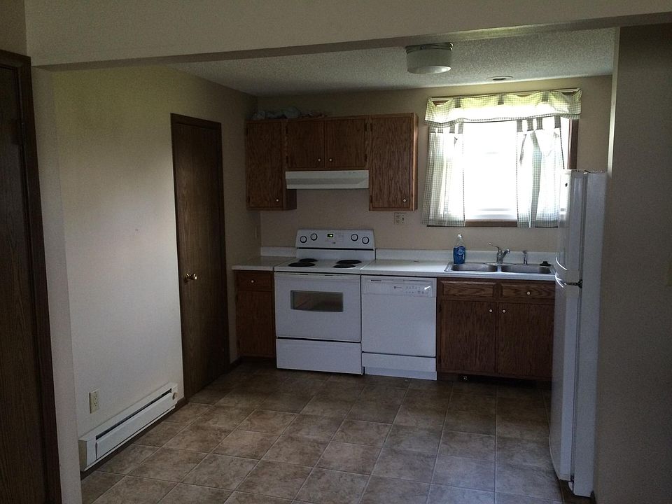 Kitchen area with wood grain flooring