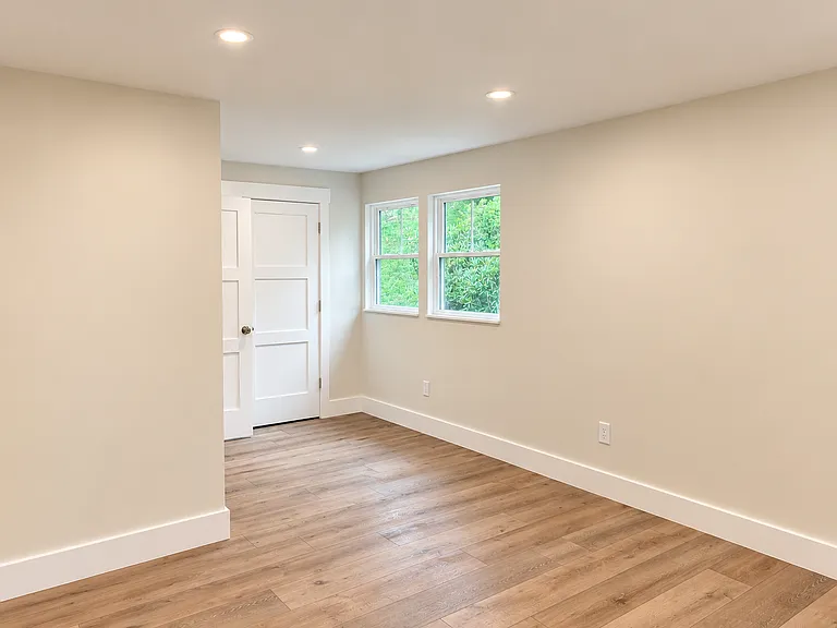 The primary bedroom also boasts a well-appointed walk-in closet providing exceptional storage and organization.