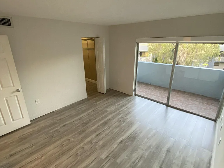 First bedroom with beautiful balcony and walk-in closet