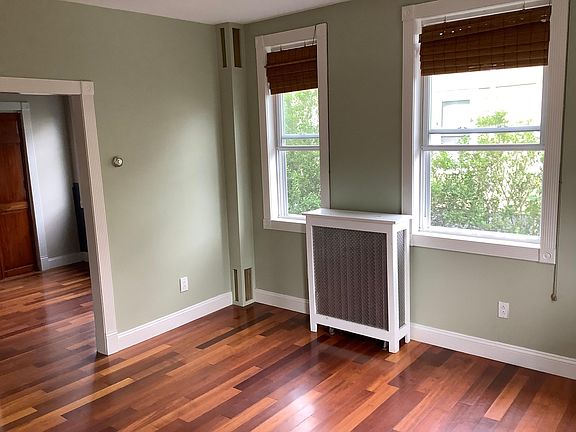 Enter in the living room with a view of the office beyond.