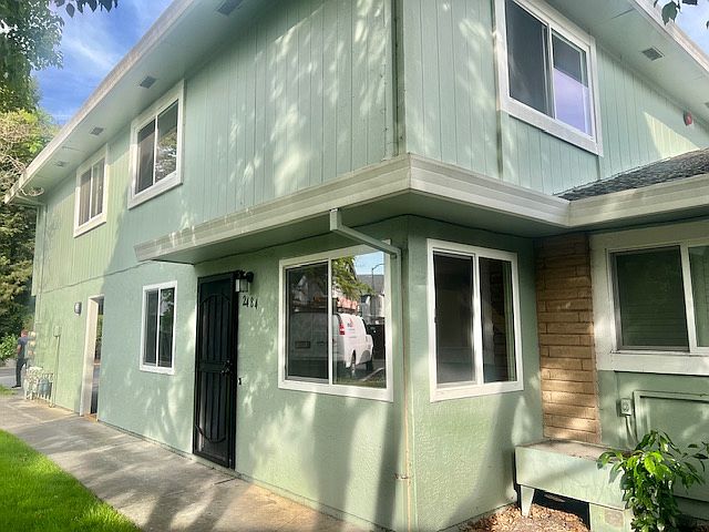 Front door with multiple windows for natural light