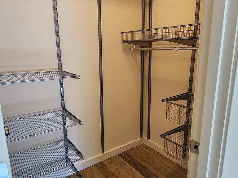 Walk in closet with Elfa storage system
