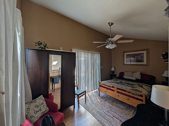 Second sleeping area: open loft with a comfortable bed and room to unwind.