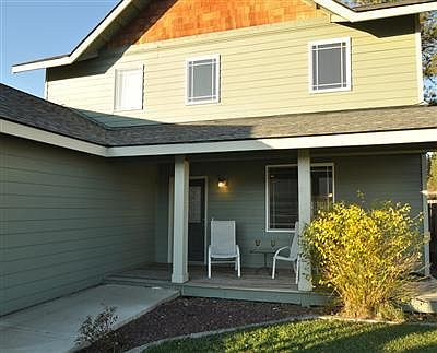 Enjoy the outdoors and views of Peoh Pt. from the covered porch. Cedar shingles and river rock adorn