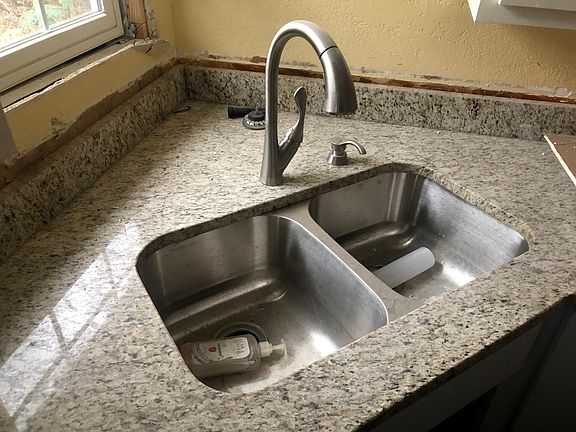 New kitchen sink and faucet and new granite counter tops.