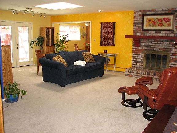 Spacious living/dining area with skylight