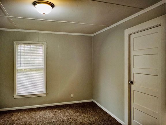 Bedroom with new carpet paint and window