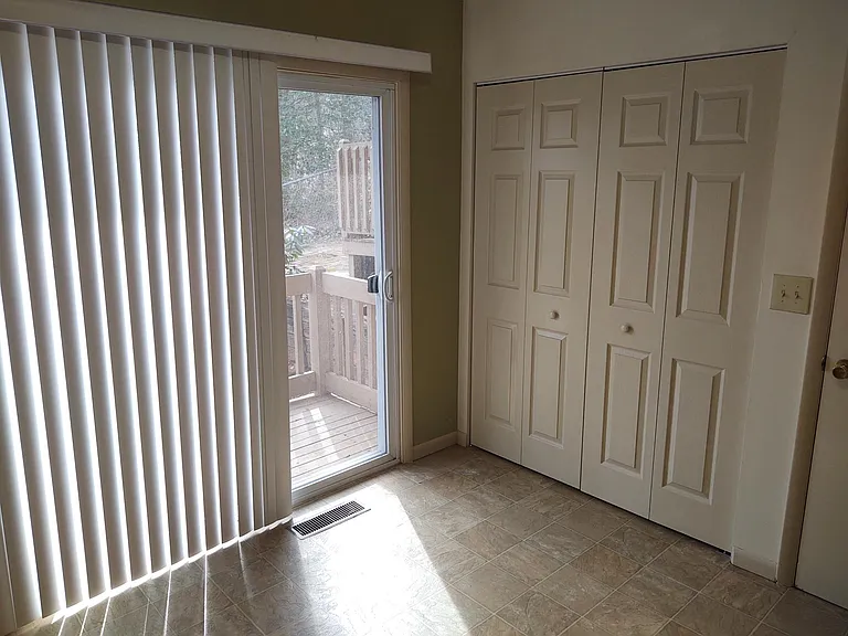 Kitchen showing doors to laundry area.