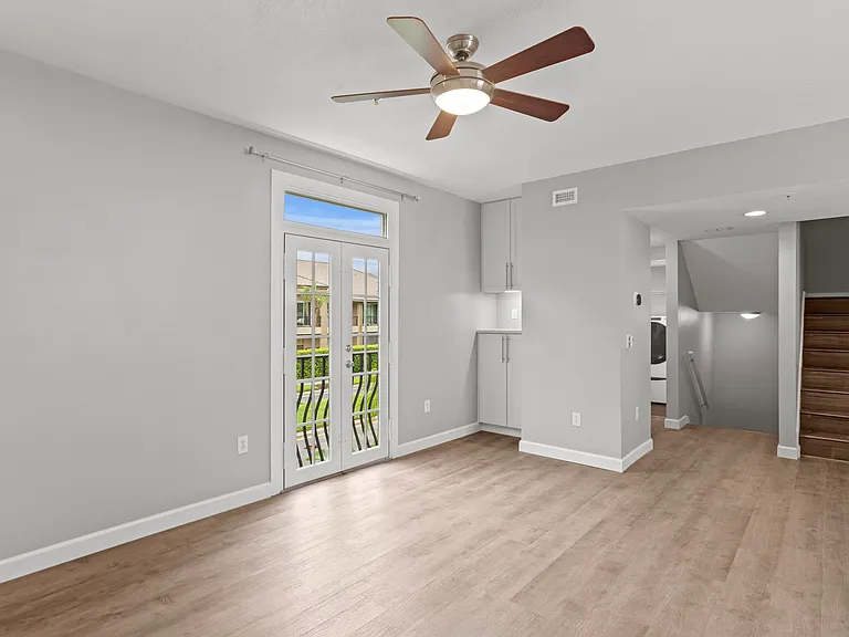 Living room with open floor plan and a dry bar