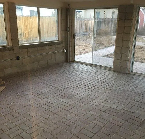 Rear enclosed sun room leading to back yard. Great casual living space.