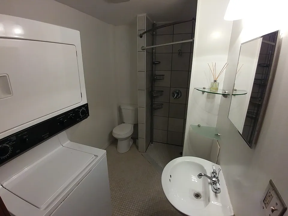 Bathroom with washer and dryer