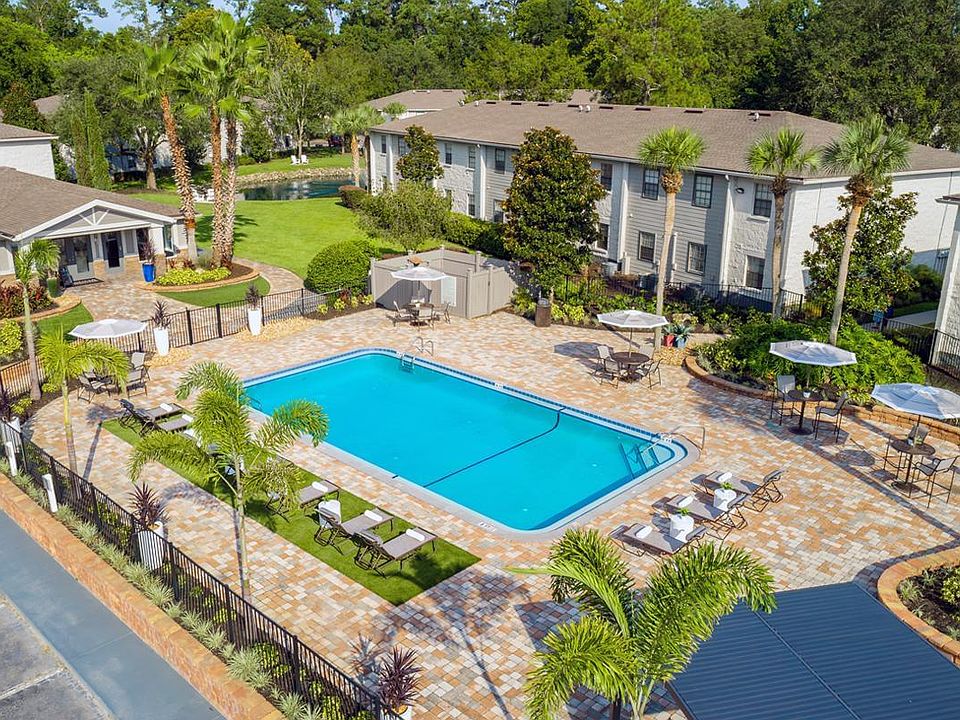 Our expansive sundeck features plenty of poolside seating including loungers and tables with umbrellas.