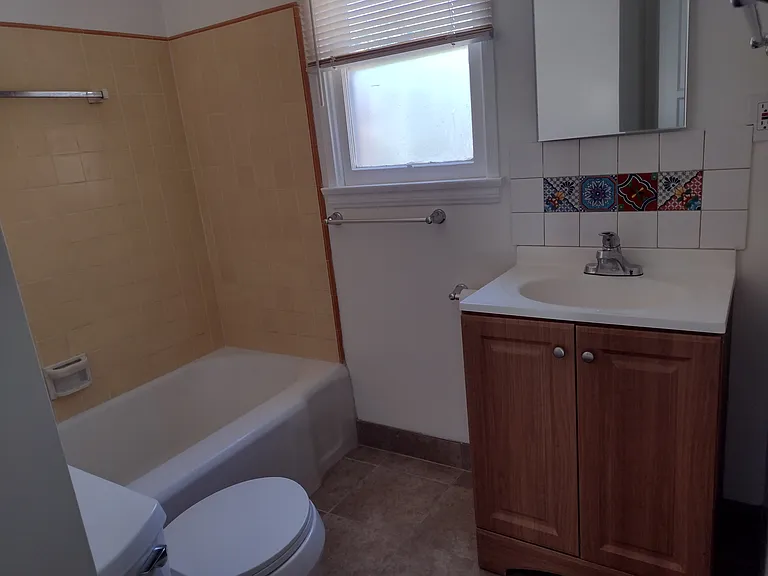 Bathroom is bright and cheery.