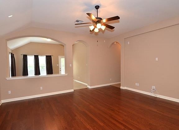 The family room offers a high ceiling and is pre-wired for surround sound.