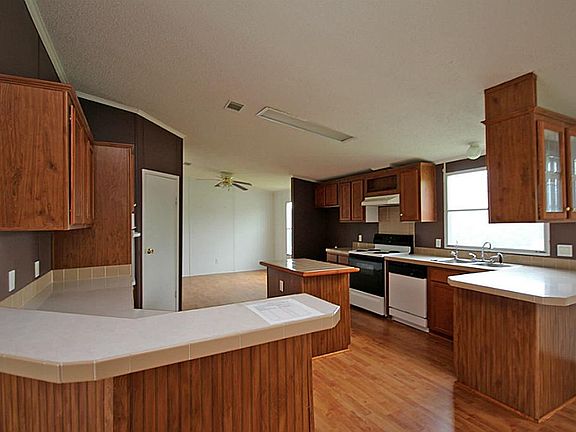 Island kitchen has lots of counter space and cabinet storage!