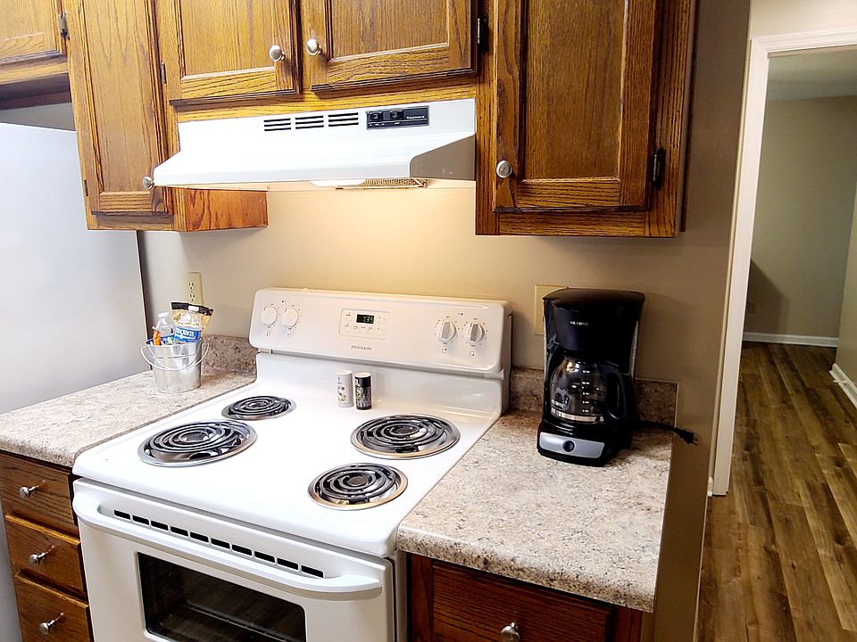 Kitchen is equipped with Full size stove, refigerator, dishwasher, and Microwave along with cookware, dishes, and more