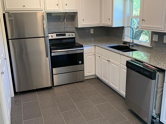 Kitchen with granite counters and stainless appliances