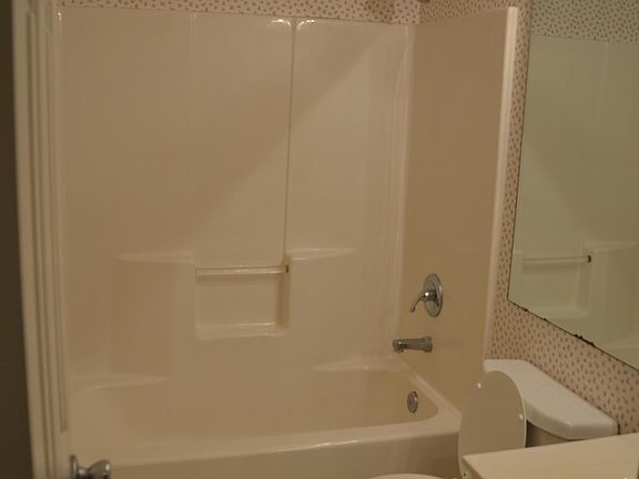 Guest bathroom flooring has been updated to laminate